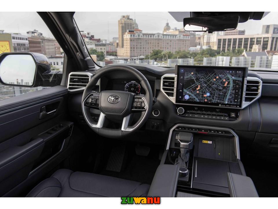 the inside of a car with a large screen